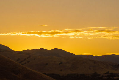 Scenic view of mountains against sky during sunset