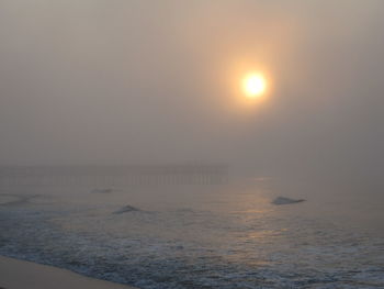 Scenic view of sea against clear sky during sunset