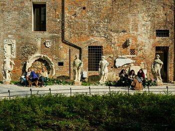 Man standing in front of old building