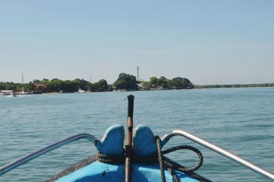 Nautical vessel on sea against clear sky