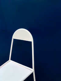 White chair on blue background