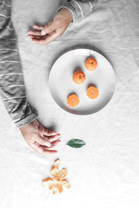 High angle view of woman holding ice cream