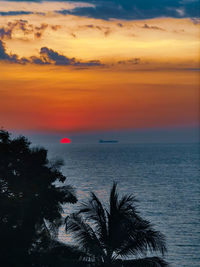 Scenic view of sea against romantic sky at sunset