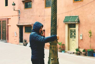 Full length of man standing in city