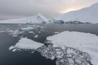 Scenic view of frozen lake against sky