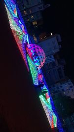 High angle view of illuminated buildings in city at night