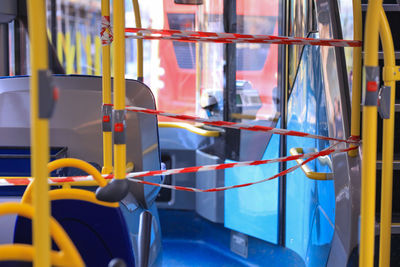 Close-up of yellow car against window