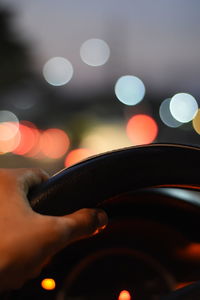 Close-up of human hand in car