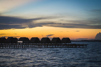 Scenic view of sea against orange sky