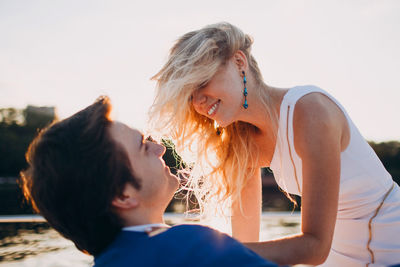 Happy couple embracing outdoors