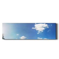 View of trees against blue sky