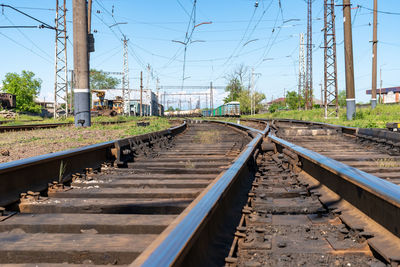 Surface level of railroad tracks against sky