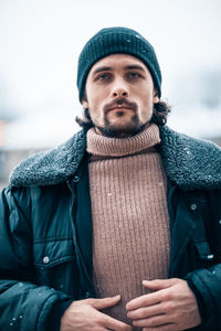 Man in city during snowfall