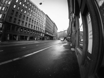 Road in city against sky