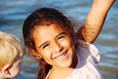 Portrait of a smiling girl with water