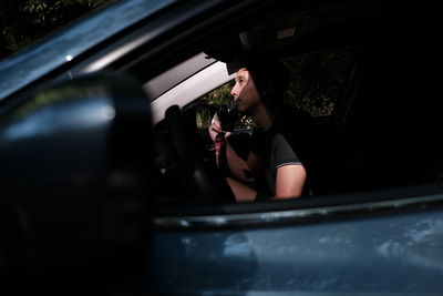 People sitting in car