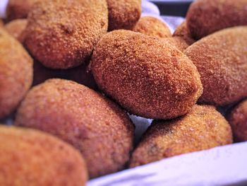 Close up of a group of italian fried supplì rice balls