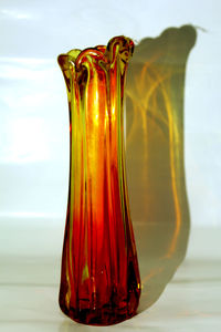 Close-up of glass bottle on table