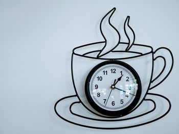 Close-up of clock on wall