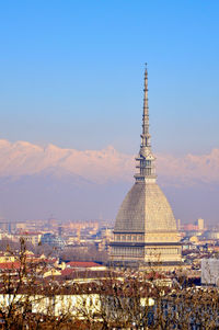 Low angle view of statue of mole antonelliana building against sky