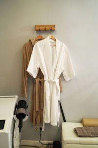 Cotton robes hanging in a cosmetology room in an antiaging clinic