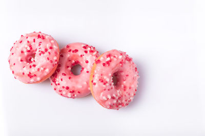 Close-up of pink roses against white background