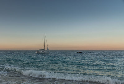 Scenic view of sea against clear sky during sunset