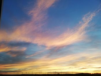 Low angle view of dramatic sky during sunset