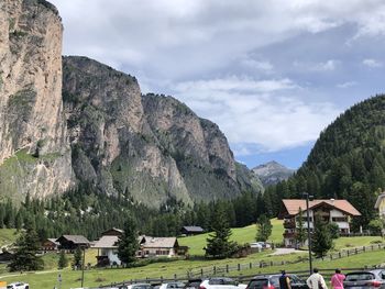 Houses on mountain against sky