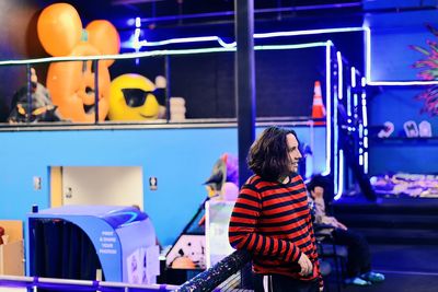 High angle view of woman sitting on street