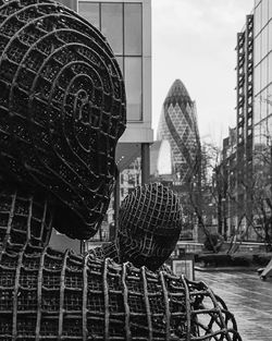 Modern sculpture with sir norman foster building in background