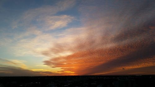 Scenic view of silhouette landscape against sky at sunset