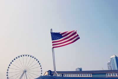 Low angle view of flag against clear sky