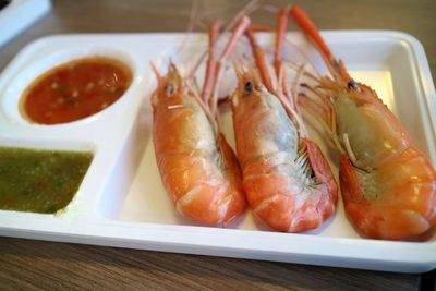 High angle view of fish in plate on table