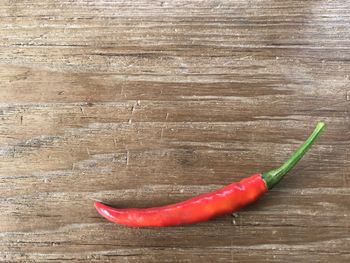 High angle view of red chili peppers on table