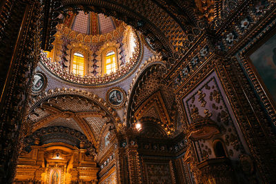 Low angle view of illuminated ceiling of building