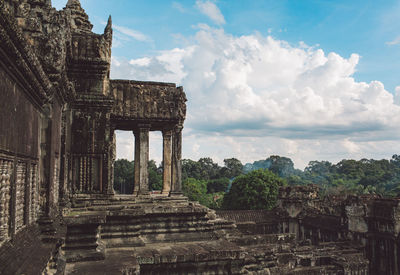 Old ruins of temple against cloudy sky