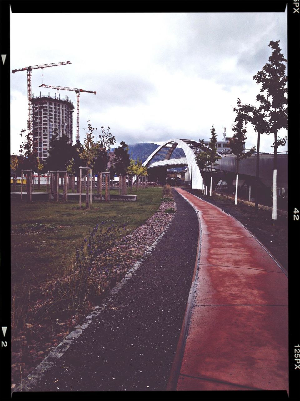 building exterior, transfer print, architecture, sky, built structure, auto post production filter, cloud - sky, the way forward, cloudy, road, transportation, street, diminishing perspective, cloud, house, city, overcast, day, outdoors, empty