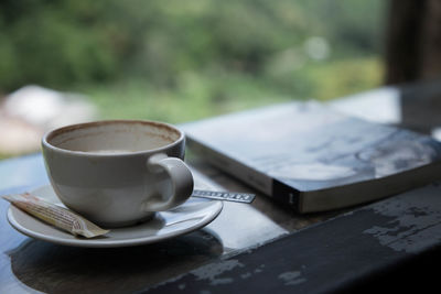 Close-up of coffee cup on table