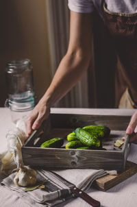 Midsection of person preparing food in kitchen