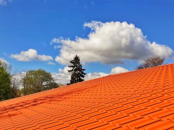 Low angle view of roof and building against sky