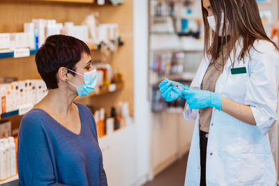 Woman taking vaccination at hospital