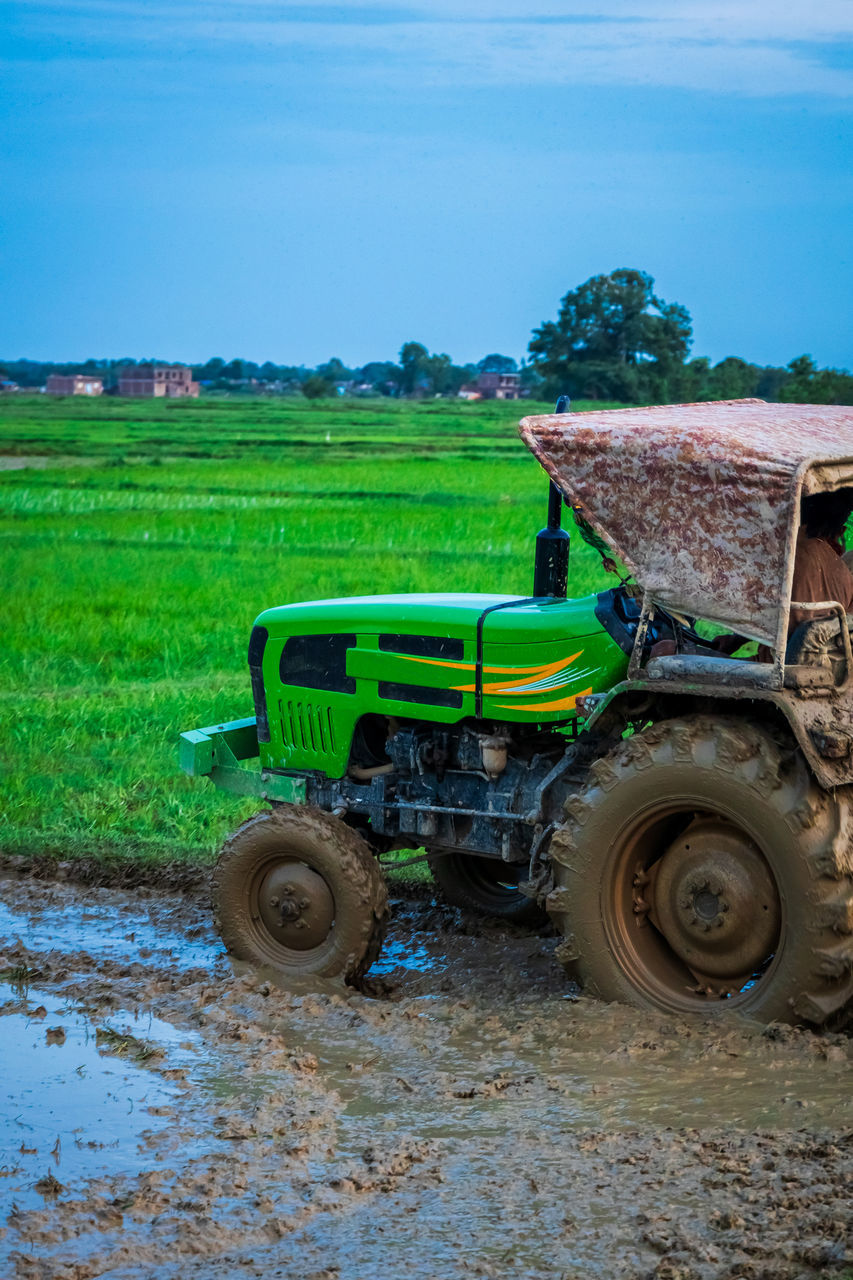 TRACTOR ON AGRICULTURAL FIELD