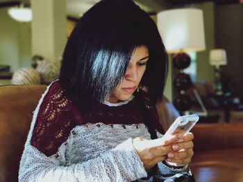 Young woman using mobile phone