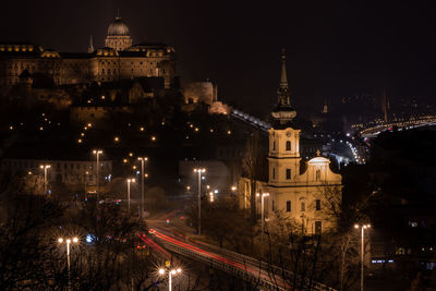 Illuminated buildings in city at night