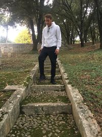 Portrait of young man standing on land