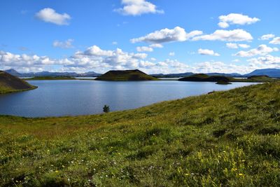 Scenic view of lake myvatn by mountains against sky