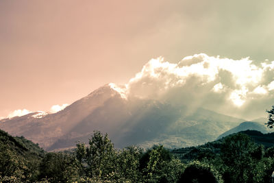 Scenic view of mountains against sky during sunset