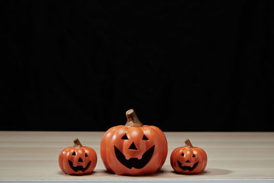 View of pumpkins against black background