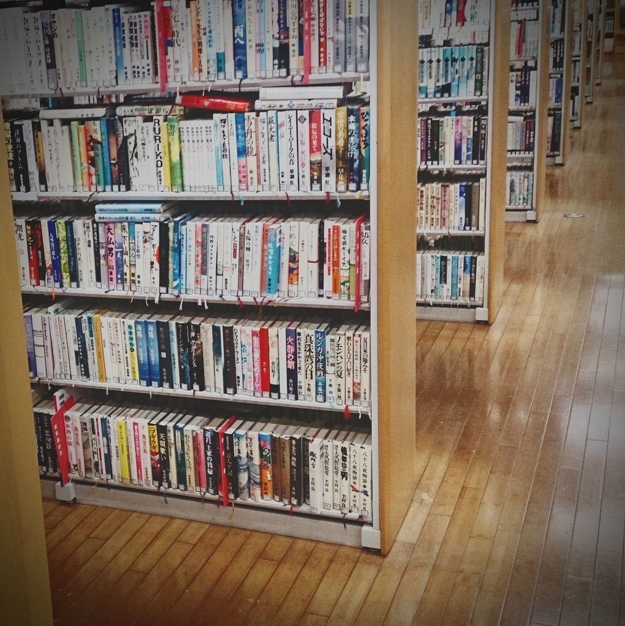 indoors, book, large group of objects, arrangement, variation, shelf, education, in a row, wood - material, order, abundance, multi colored, bookshelf, choice, still life, collection, no people, full frame, table, literature